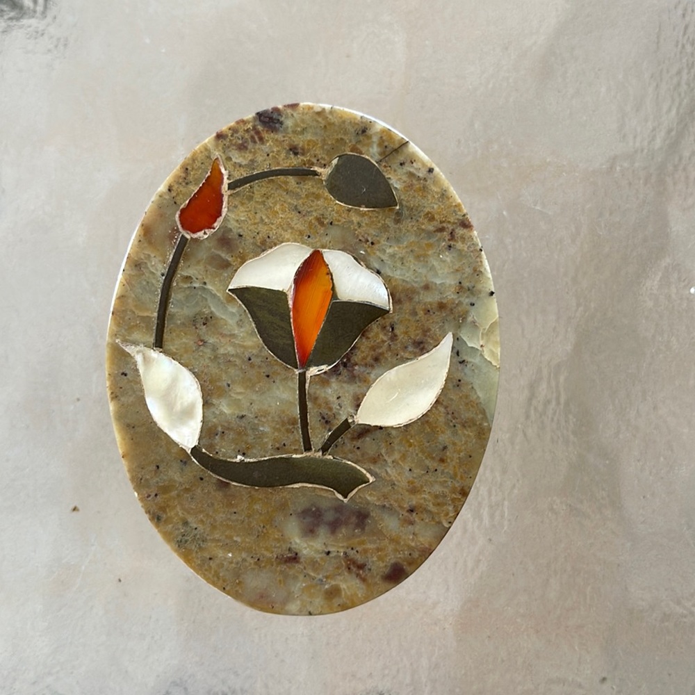 Marble oval box with inlaid design on cover. Made in India